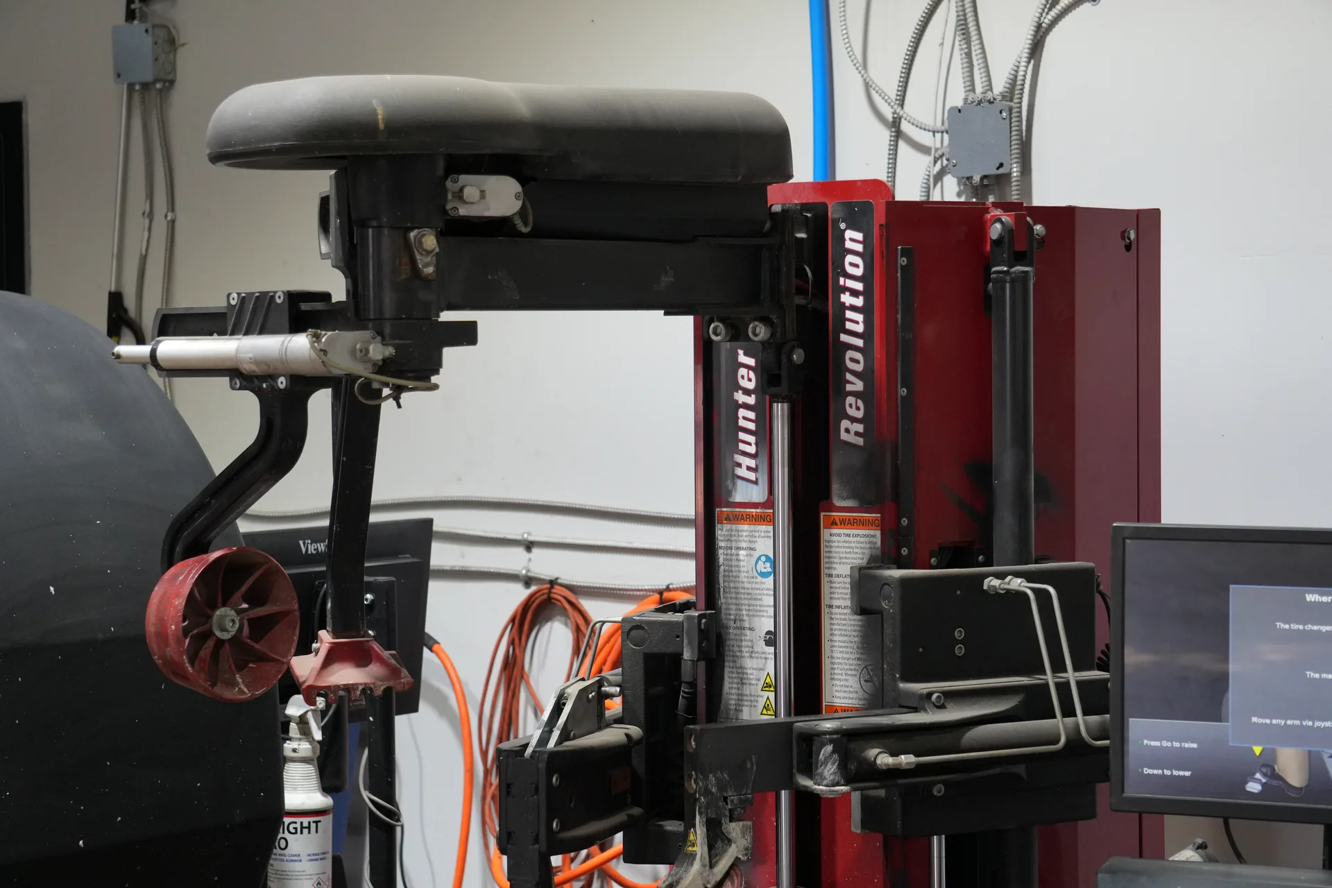 Tire changing equipment in the Auto Wise workshop.